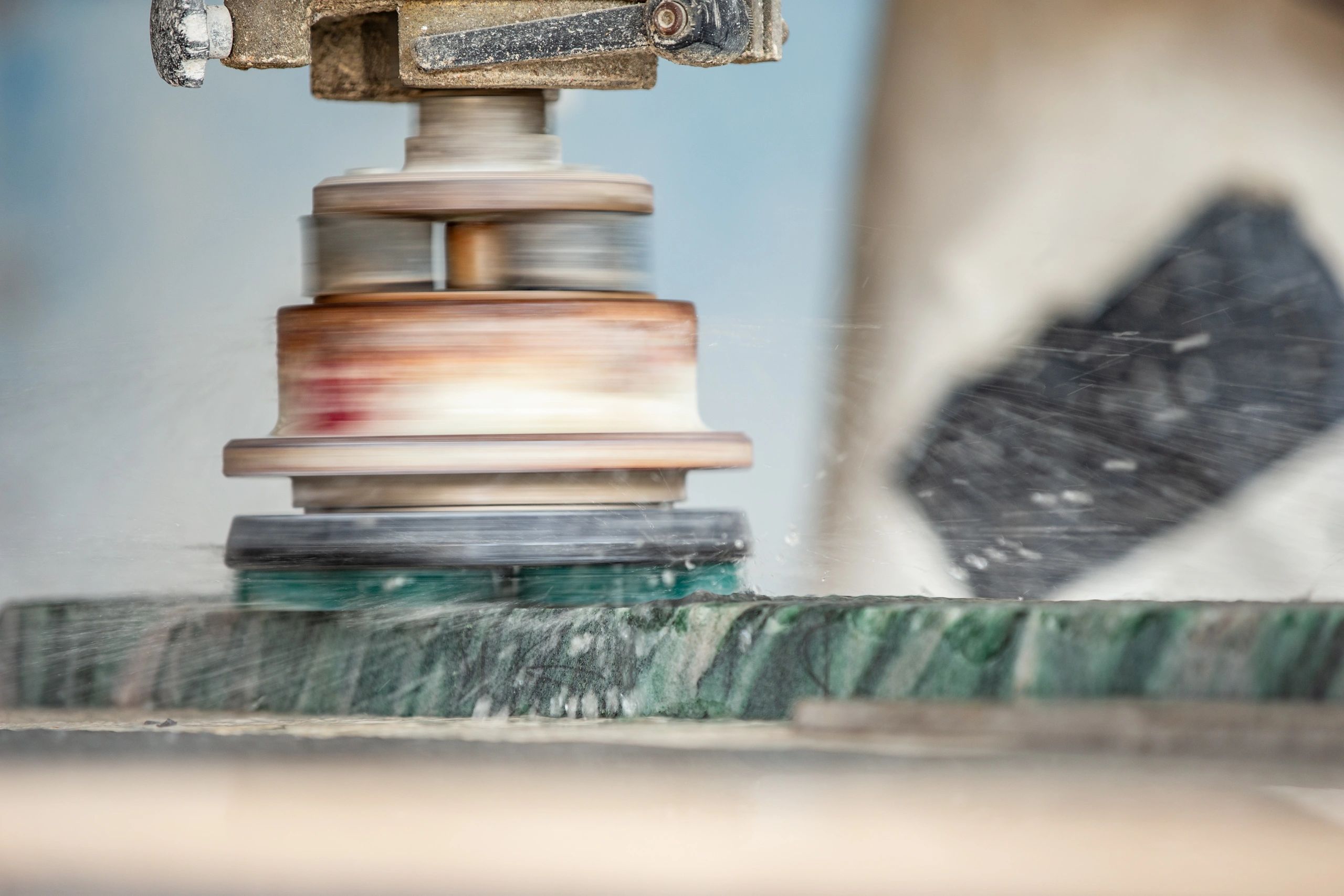 Stone polishing process showing countertop craftsmanship